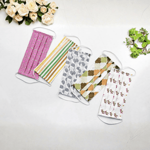Five fabric face masks with different patterns