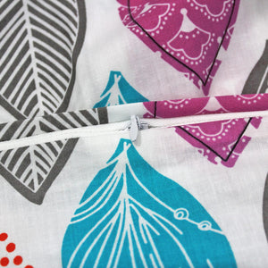 Close-up of fabric with colorful patterns and a zipper.