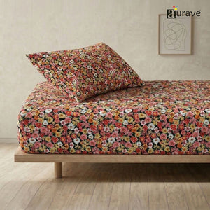 AURAVE kids single flat bedsheet and pillow cover featuring a vibrant multicolored floral print on a dark background, side angle view.