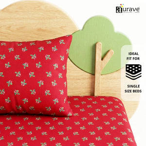 Vibrant red patterned pure cotton kids pillow leaning against a wooden tree and cloud headboard, showcasing AURAVE premium bedding.