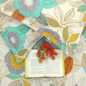 Cotton blend double bedsheet with teal and yellow floral print, folded display