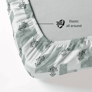 Fitted sheet with elastic all around on a mattress, showing a geometrical pattern.