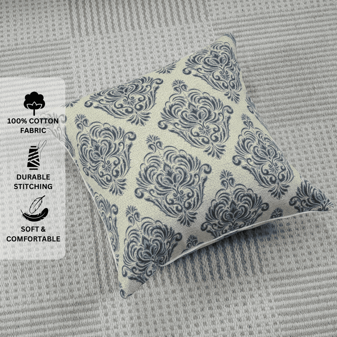 Decorative pillow with blue pattern on a textured gray surface, featuring text labels about fabric and comfort.