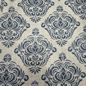Patterned fabric with dark blue floral design on a beige background