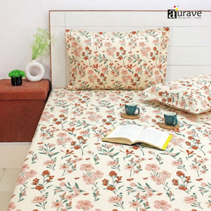 Floral bedding set on a bed with 'aurave' branding.