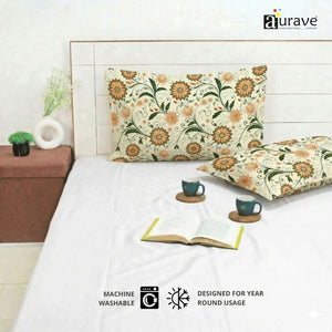 Eczema skin-friendly and zero color fading cotton pillow covers by AURAVE showing precision stitching and an orange floral vine pattern.