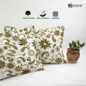 Neatly stacked AURAVE cotton pillow covers showcasing a beautiful earthy brown floral and paisley motif.