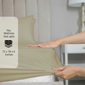 Taupe bedsheet being stretched over mattress corner with size label showing fits mattress size up to 72 x 78 x 6 inches.