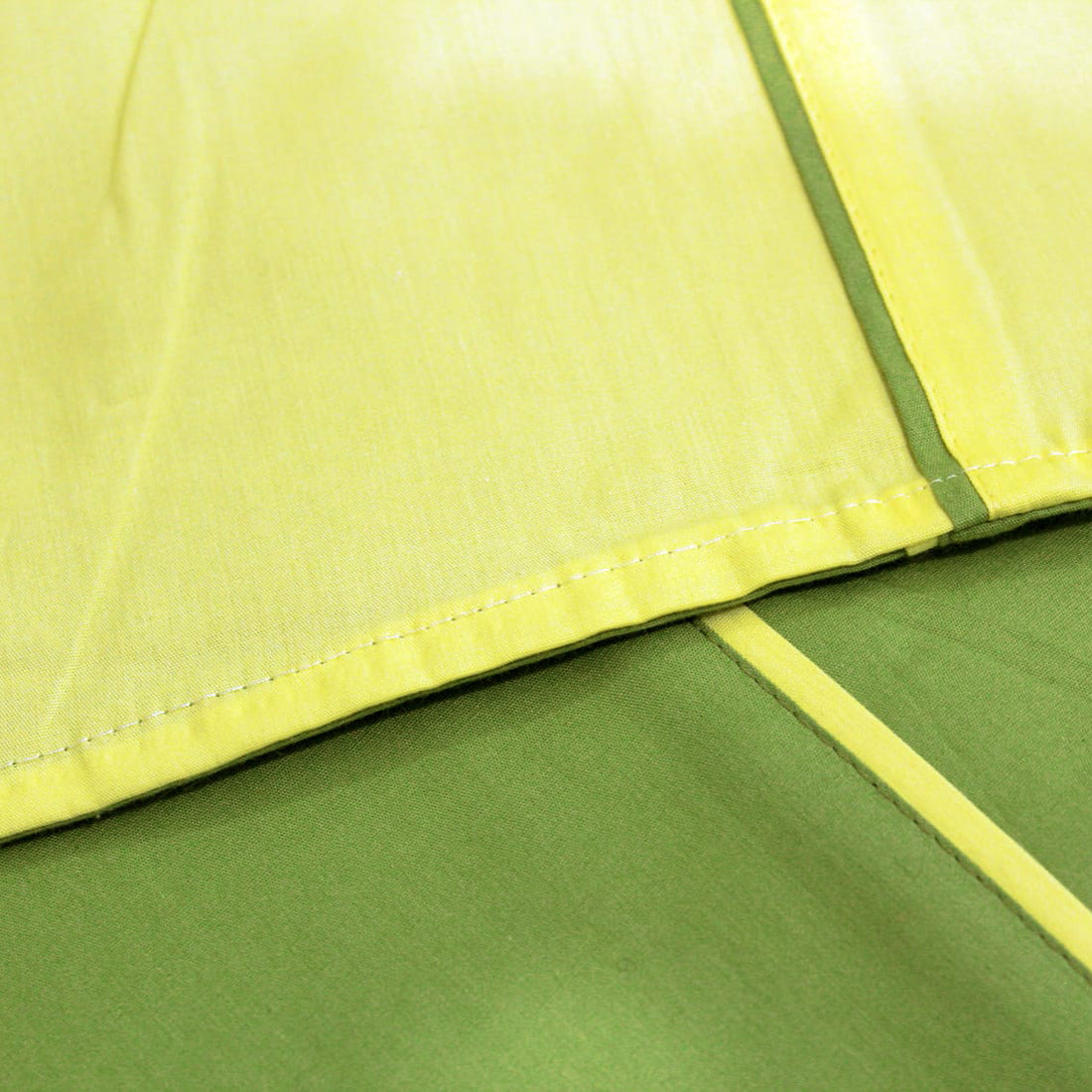 Close-up of Plain 210 TC Mercerised Cotton Duvet Cover - Green & Light Yellow