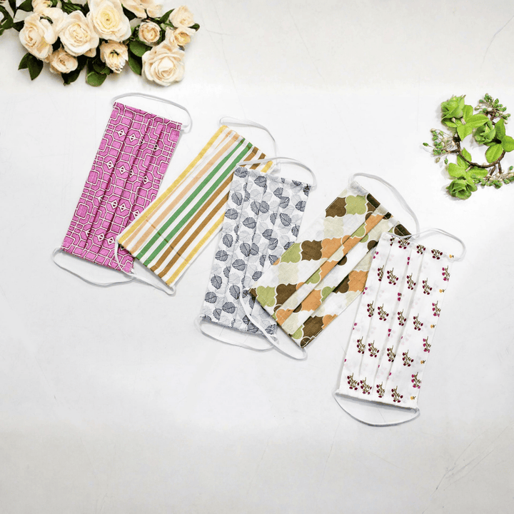 Five fabric face masks with different patterns  