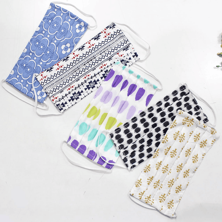 Full View Five fabric face masks with different patterns   