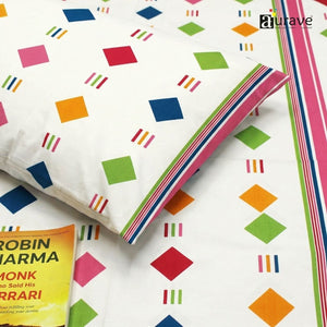 Close-up of cotton bedsheet with colorful geometric diamond print, soft texture and smooth finish