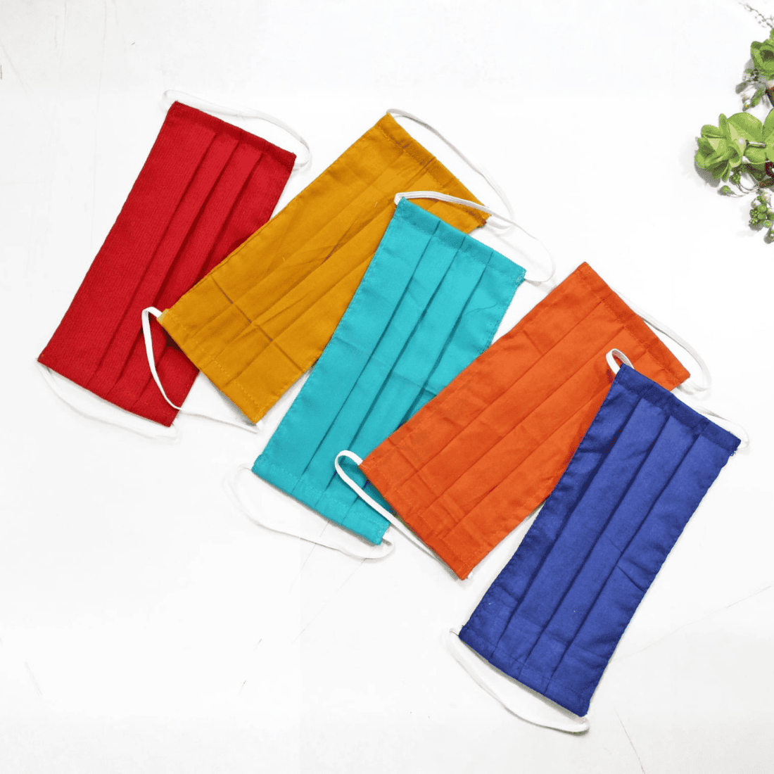 Five colorful face masks in red, yellow, blue, orange, and green 