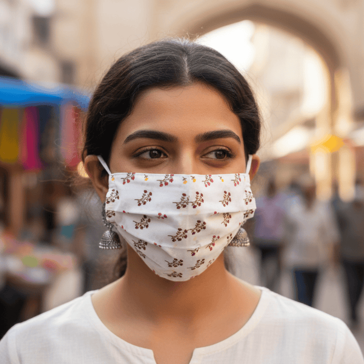 Woman wearing pink cotton pleated face mask