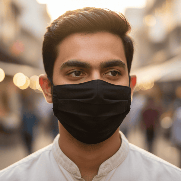 Man wearing a black face mask 
