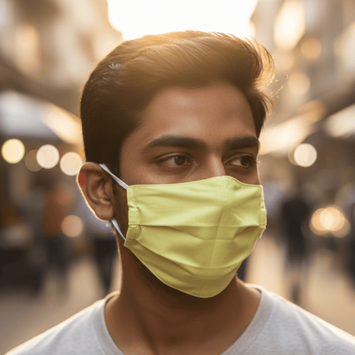 Man wearing a yellow face mask 
