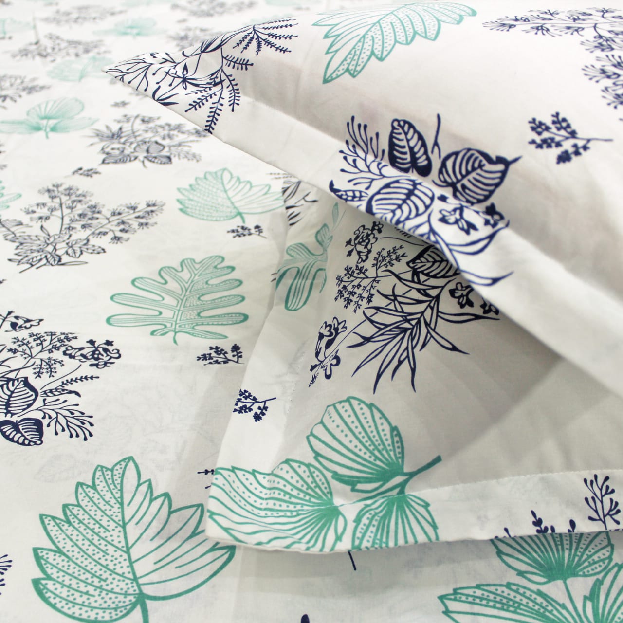 Close-up of Printed Floral Cotton 250 TC Fitted Bedsheet with Pillow Covers - Aqua