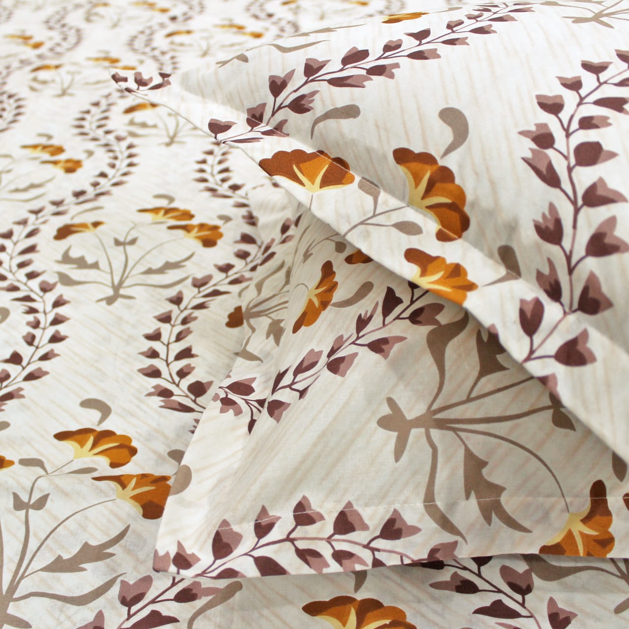 Close-up of Printed Floral Cotton 250 TC Bedsheet with Pillow Covers - Brown