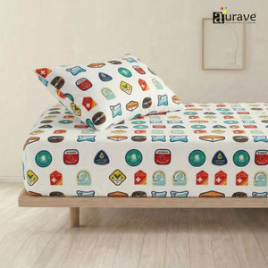 AURAVE kids single flat bedsheet and pillow cover featuring colorful adventure and merit badges on a crisp white background.