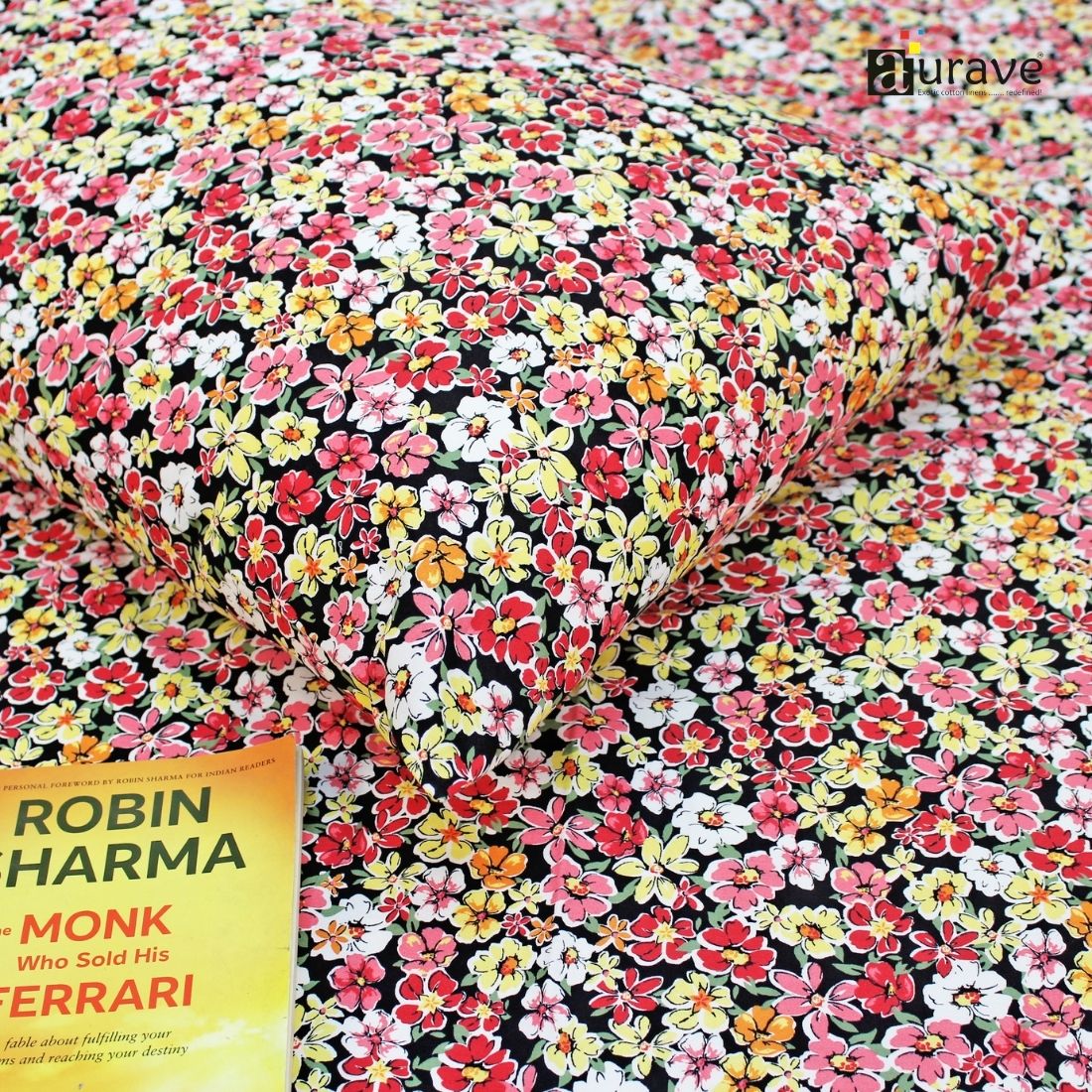 Close-up detail of a soft 210 TC pure cotton kids pillowcase and floral bedsheet, styled with a reading book.
