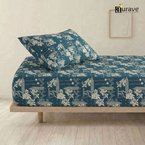 AURAVE kids single flat bedsheet and pillow cover in teal blue with intricate white paisley and floral patterns, side bed view.
