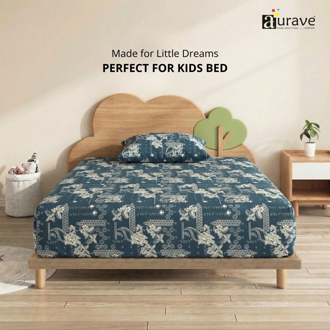 Front view of a kids wooden bed styled with an AURAVE 100% cotton teal blue single flat bedsheet featuring white floral and ethnic prints.
