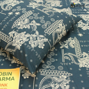 Close-up of 210 TC pure cotton kids pillowcase and bedsheet in dark teal blue with white patterns, styled with a reading book.