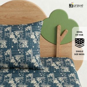 Detailed view of a teal blue patterned kids pillow resting against a wooden cloud headboard, premium cotton bedding by AURAVE.
