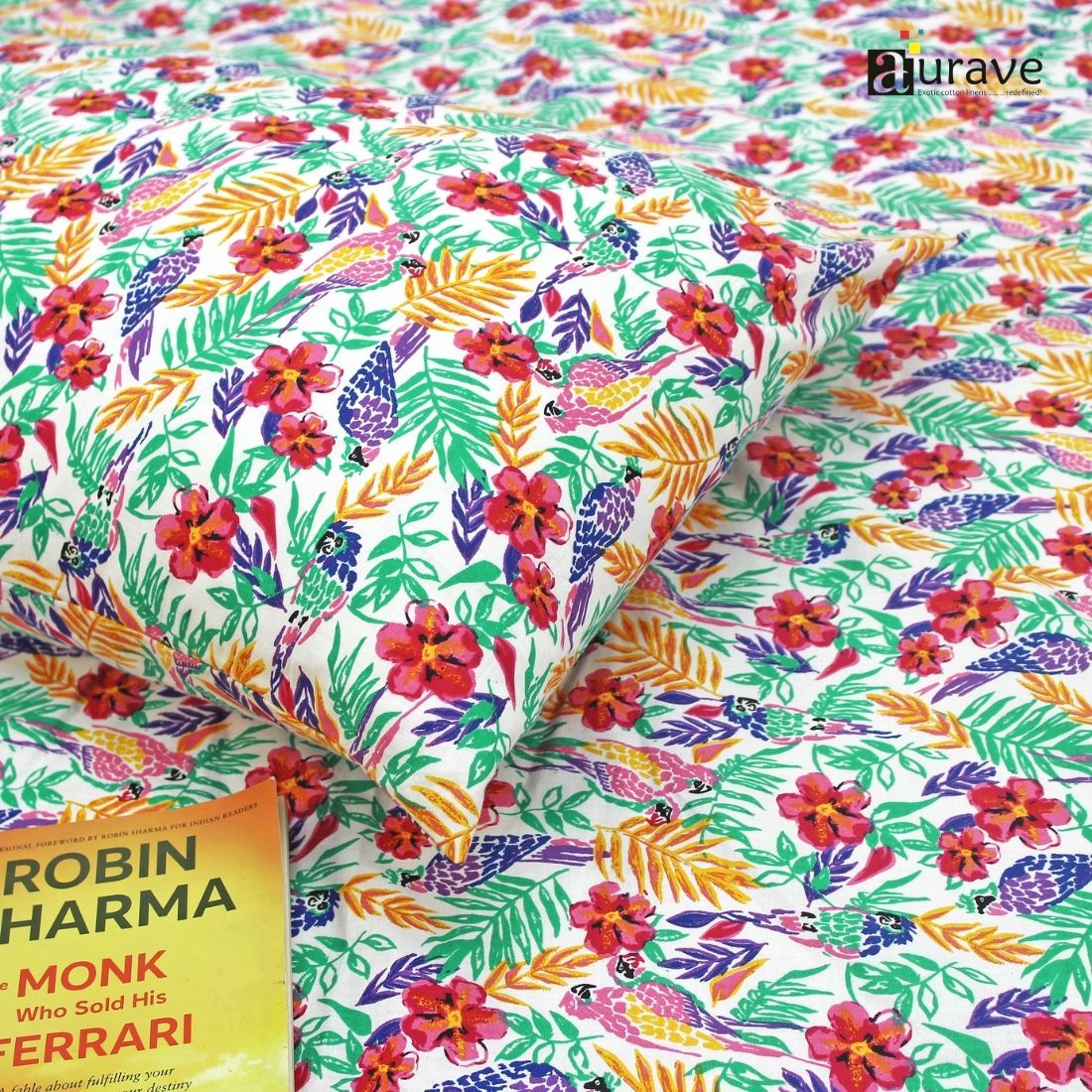 Detailed view of soft 100% cotton fabric showing bright red, pink, and yellow floral pattern for children's bedding