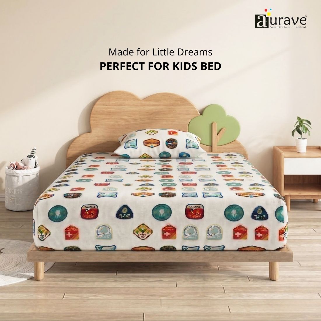Front view of a kids wooden cloud bed styled with a fun, 100% cotton white single flat bedsheet with printed scout patches by AURAVE.