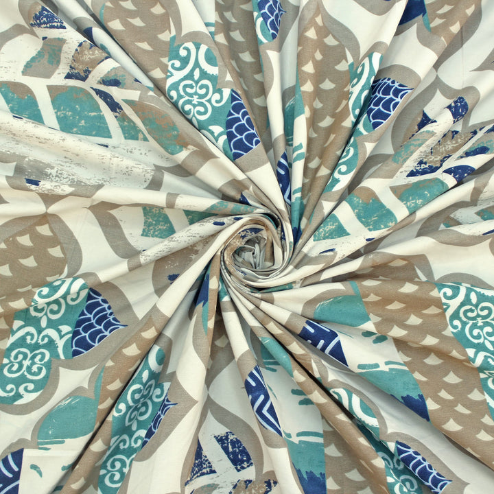 Cotton blend bedsheet fabric with blue and Abstract print, swirl folded close-up