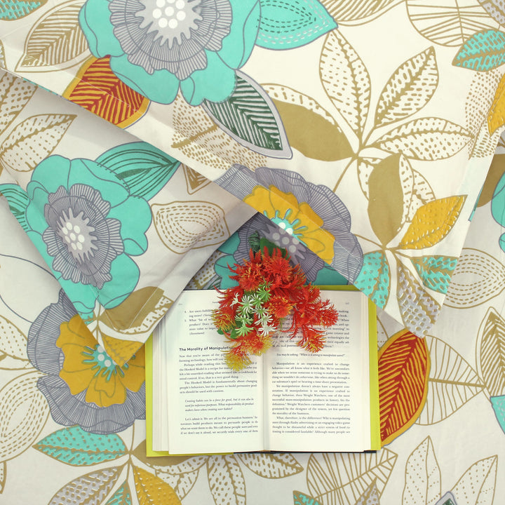 Cotton blend double bedsheet with teal and yellow floral print, folded display