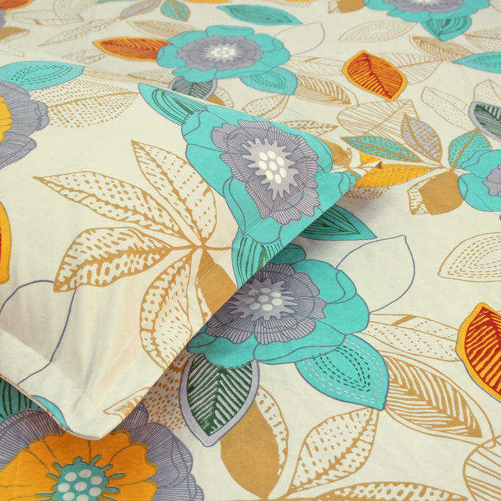 Cotton blend double bedsheet with teal and yellow floral print and matching pillow cover, close-up view
