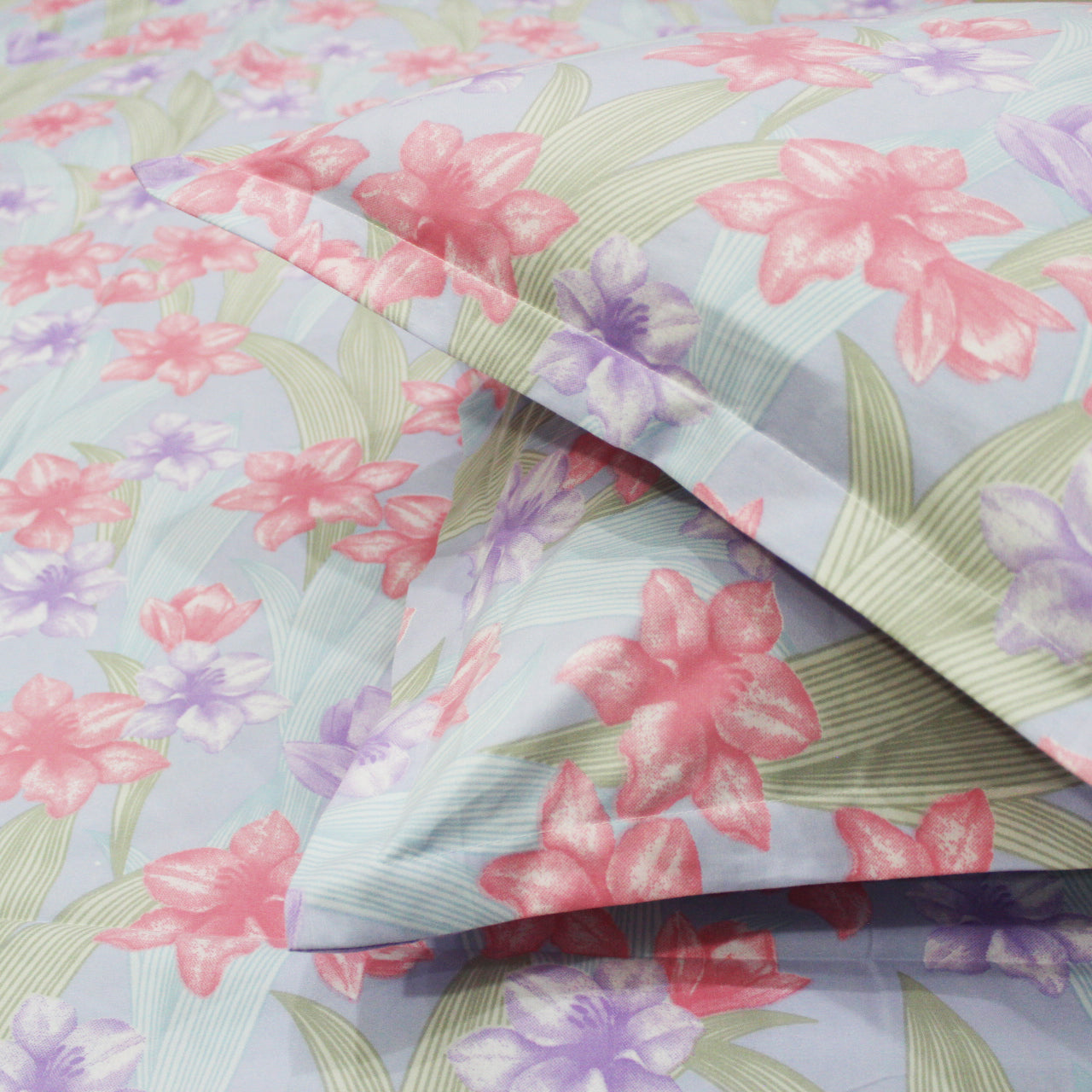 A multicolor floral fitted bedsheet with pillow covers  