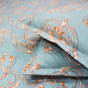 Close-up view of a blue fitted bedsheets with damask design