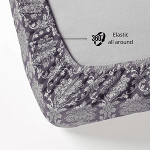 Fitted sheet with floral pattern and elastic all around feature on a bed