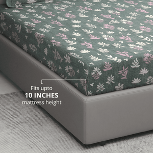 Floral patterned fitted Bedsheet on a bed 
