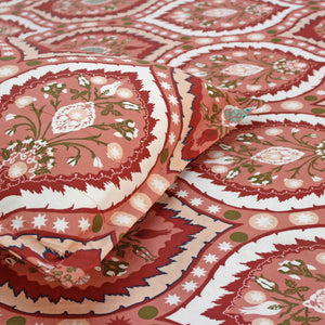 Close-up of red and white patterned fabric with floral designs