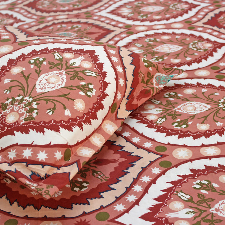 Close-up of red and white patterned fabric with floral designs