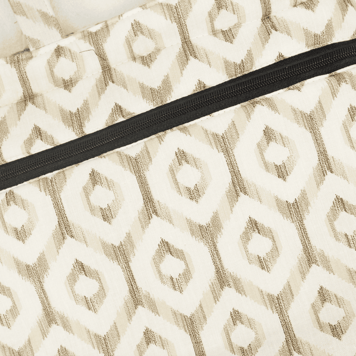 Close-up of a patterned fabric with a black zipper Shopper/Tote Bag