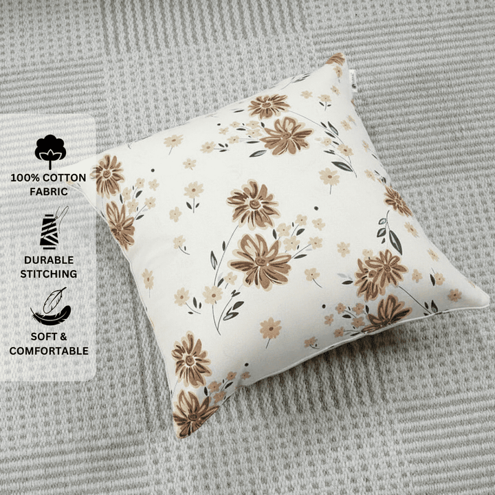 Floral-patterned pillow on a textured surface with fabric and stitching icons.