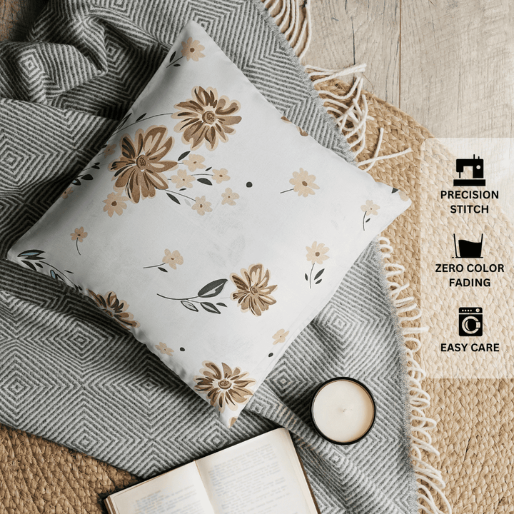 Floral-patterned pillow on a textured surface with care instructions displayed.