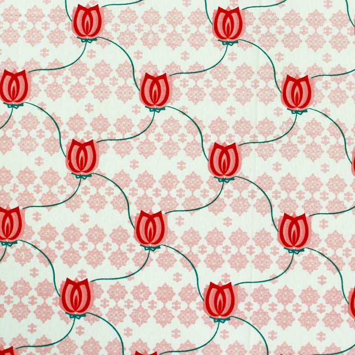 Pattern of red tulips on a light pink background with floral design
