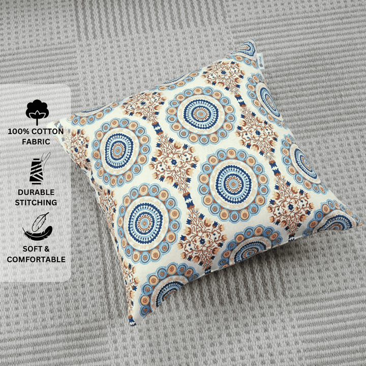 Decorative pillow with circular pattern on a gray surface, featuring text about fabric and comfort.