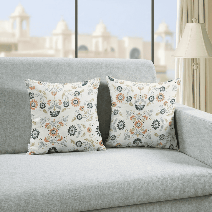 Set of floral cotton cushion covers on sofa adding elegant comfort to living room decor