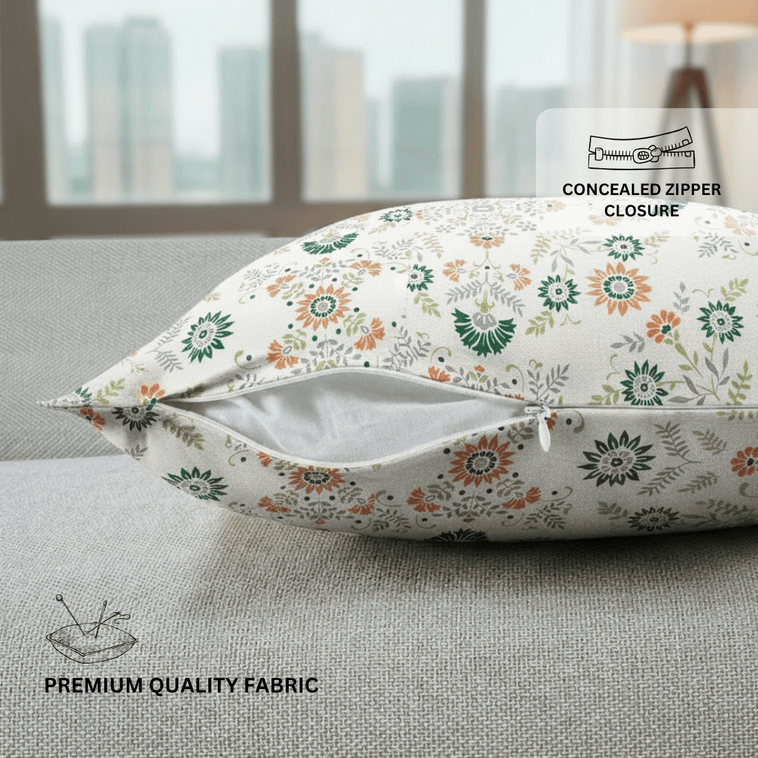 Floral-patterned pillow on a couch with text indicating concealed zipper closure and premium quality fabric.