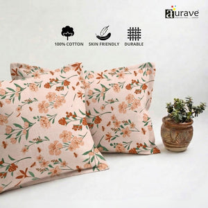 100% Cotton, skin-friendly, and durable AURAVE floral pillow covers displayed with a small indoor plant