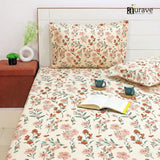 Floral bedding set on a bed with 'aurave' branding.