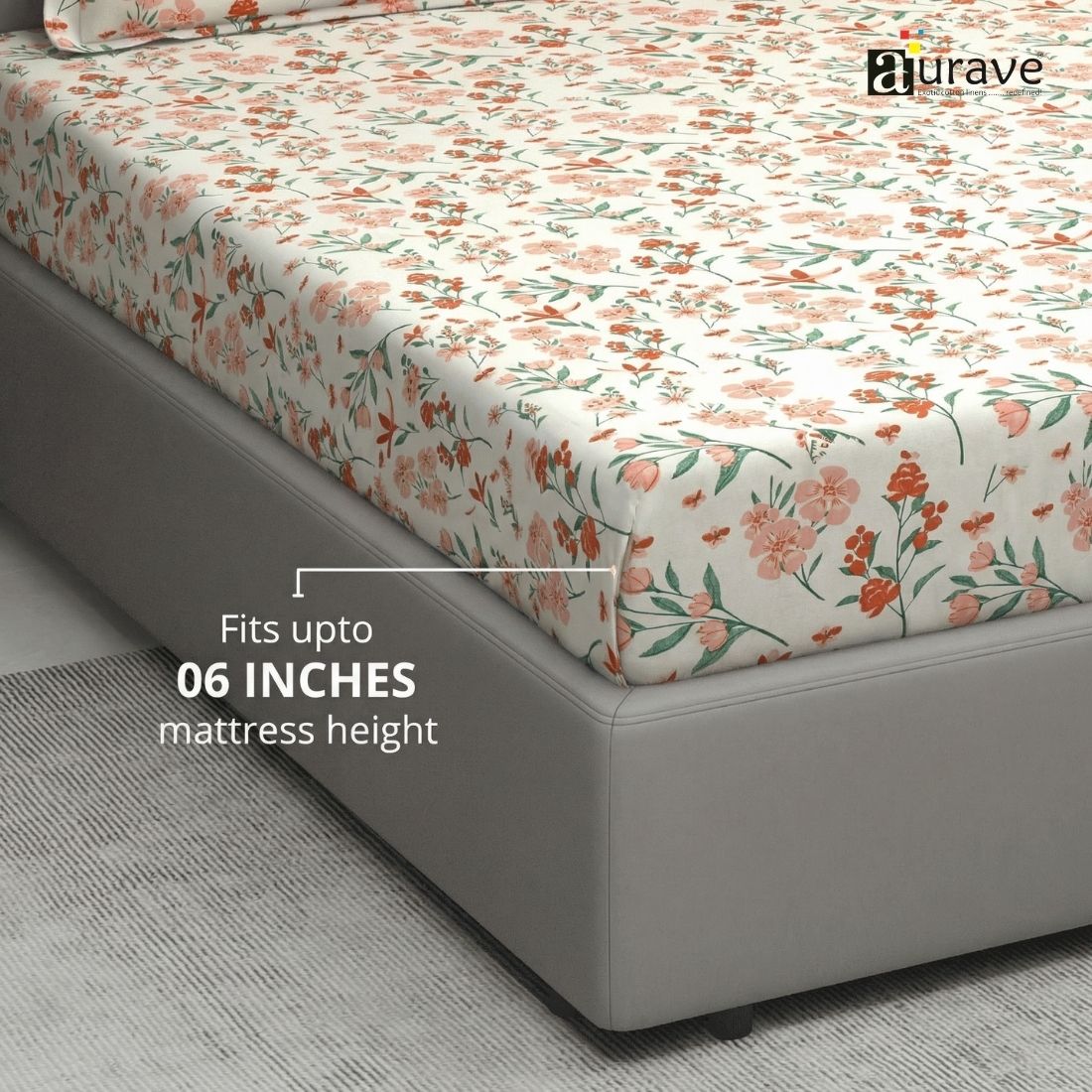 Floral patterned fitted bedsheet on a bed with 'aurave' branding.