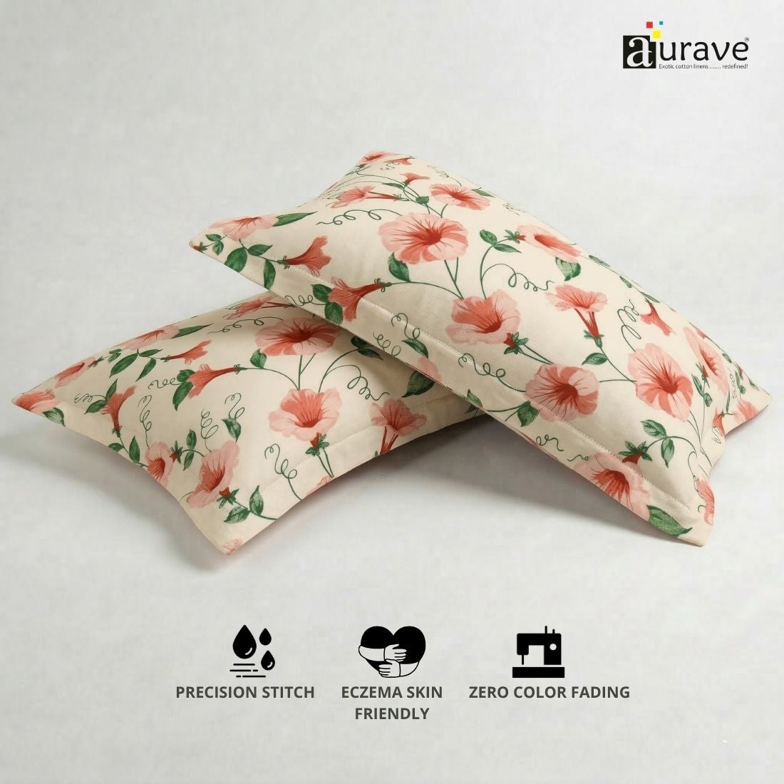 100% cotton, skin-friendly, and durable AURAVE pink floral pillow covers displayed next to a small indoor plant.